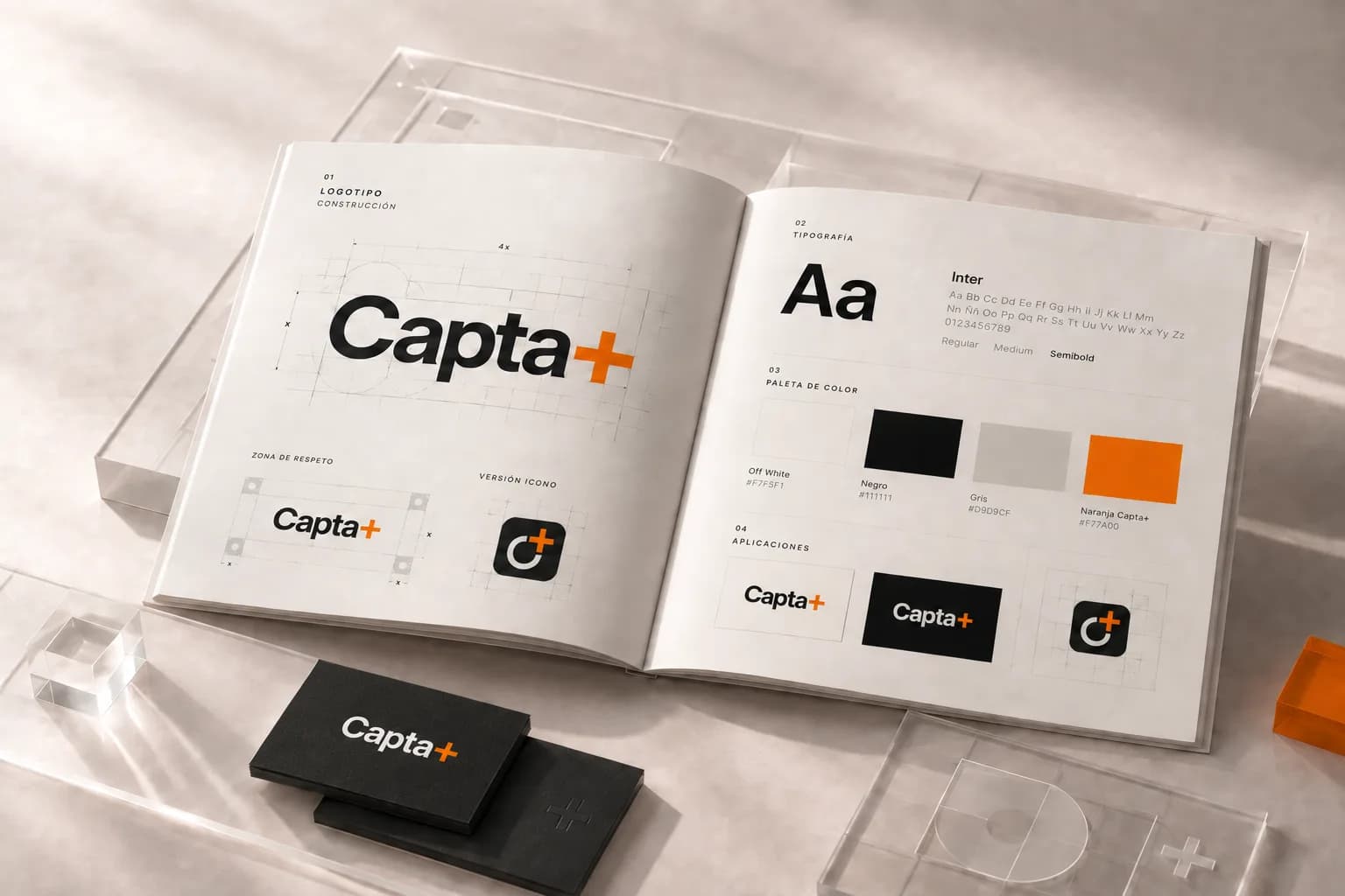 El manual de marca de Capta+ abierto: la construcción del logotipo, la tipografía, la paleta de color y sus aplicaciones, junto a tarjetas personales.